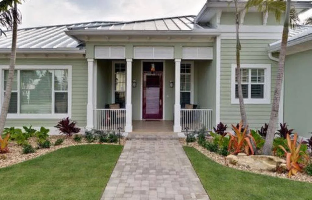 Miami home with fresh exterior paint and a new front door color