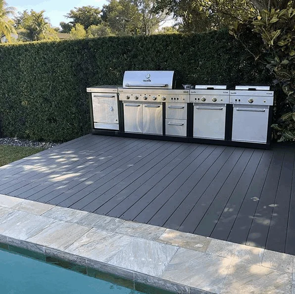 Outdoor kitchen and deck after restoration